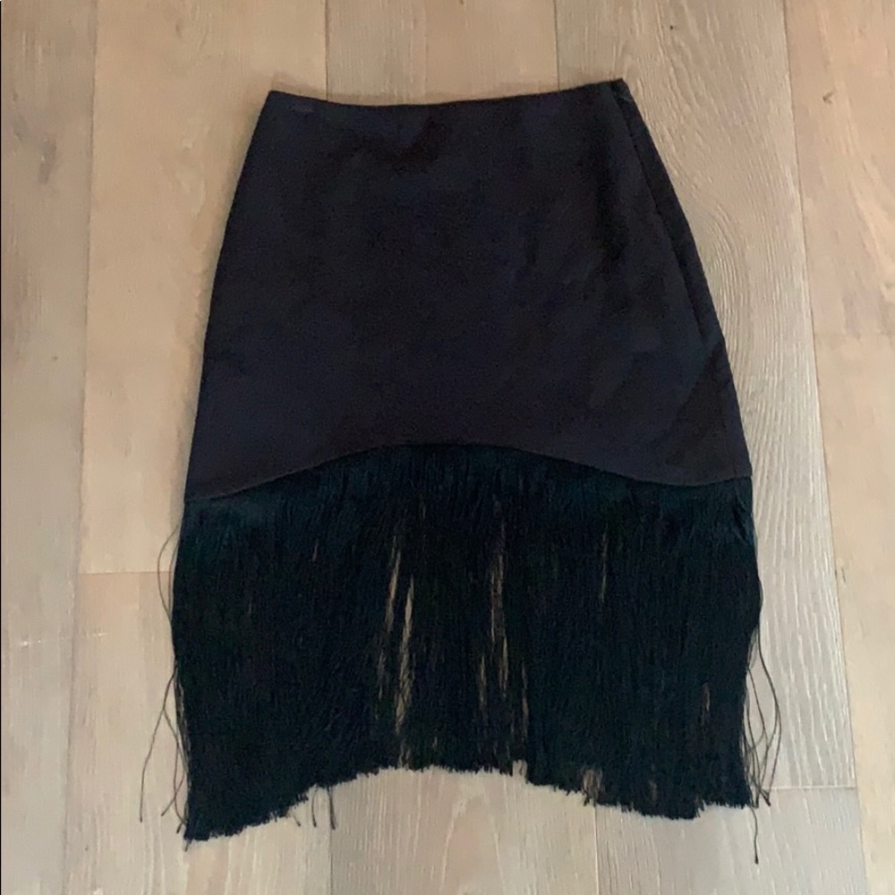 Mid length skirt with fringe.
